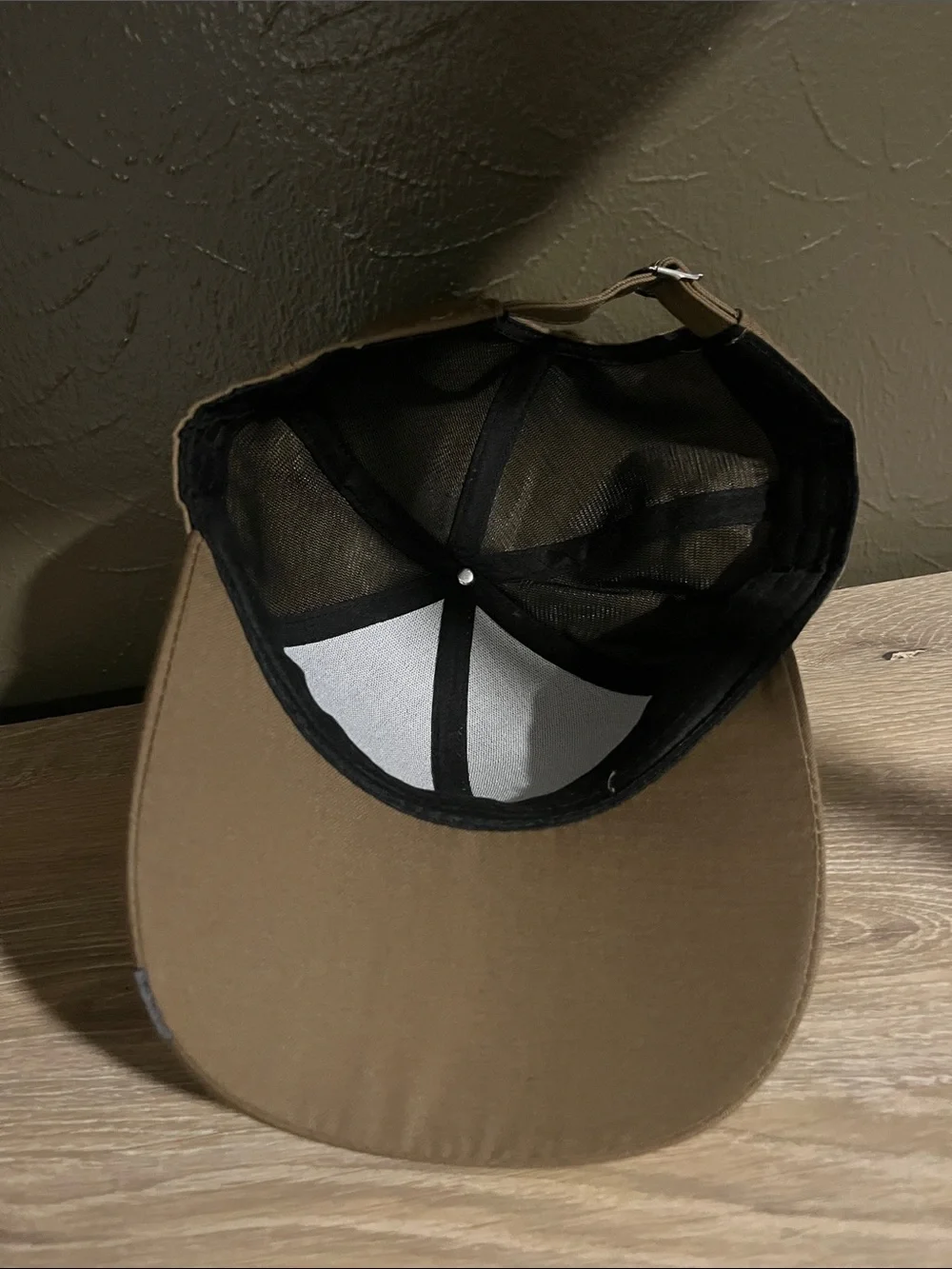 Brown Baseball Cap With Small Logo on Brim That Says “Sport Fashion”